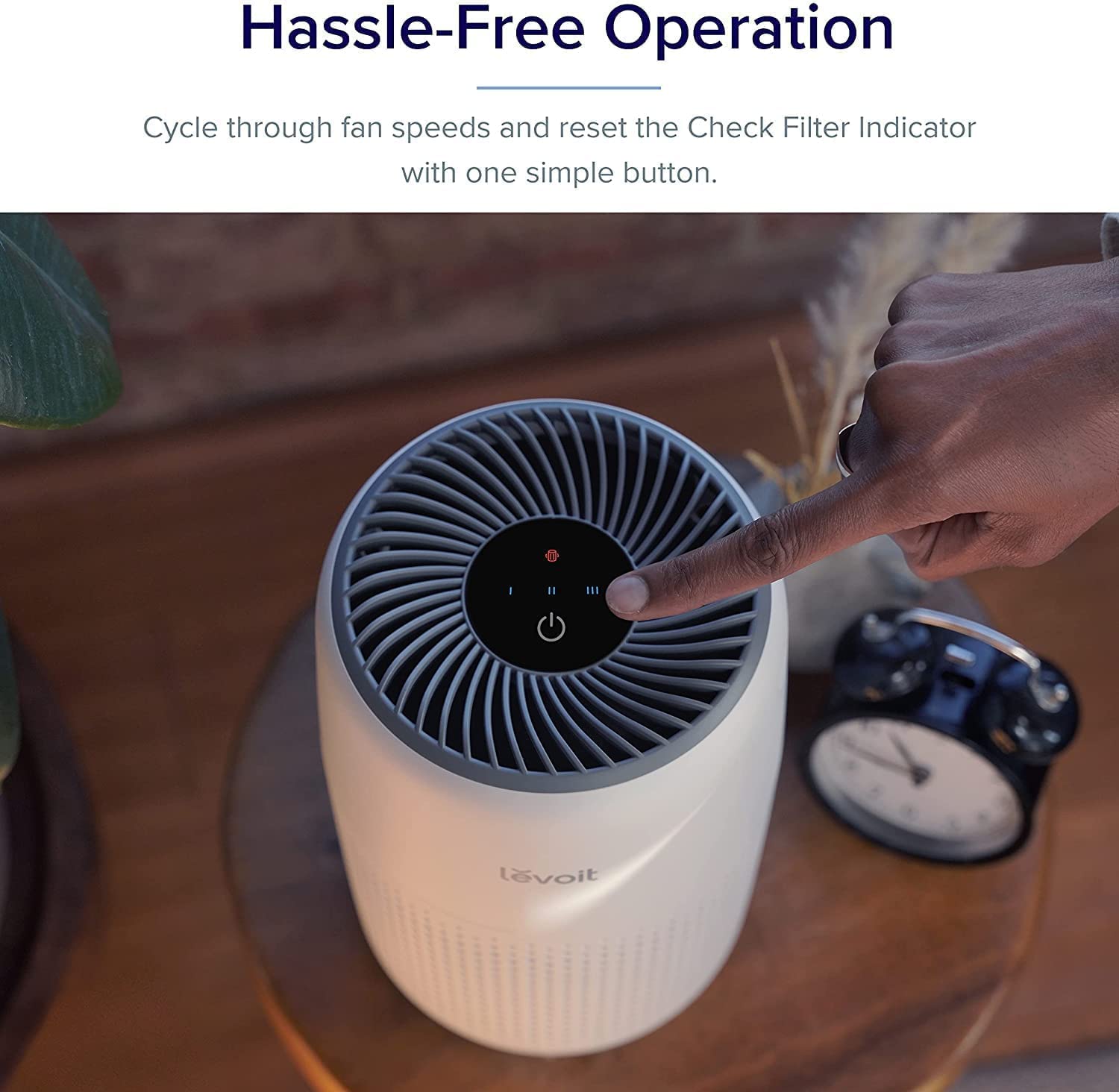 Levoit Core Mini air purifier with easy one-button operation to adjust fan speed and reset the filter indicator for hassle-free use.