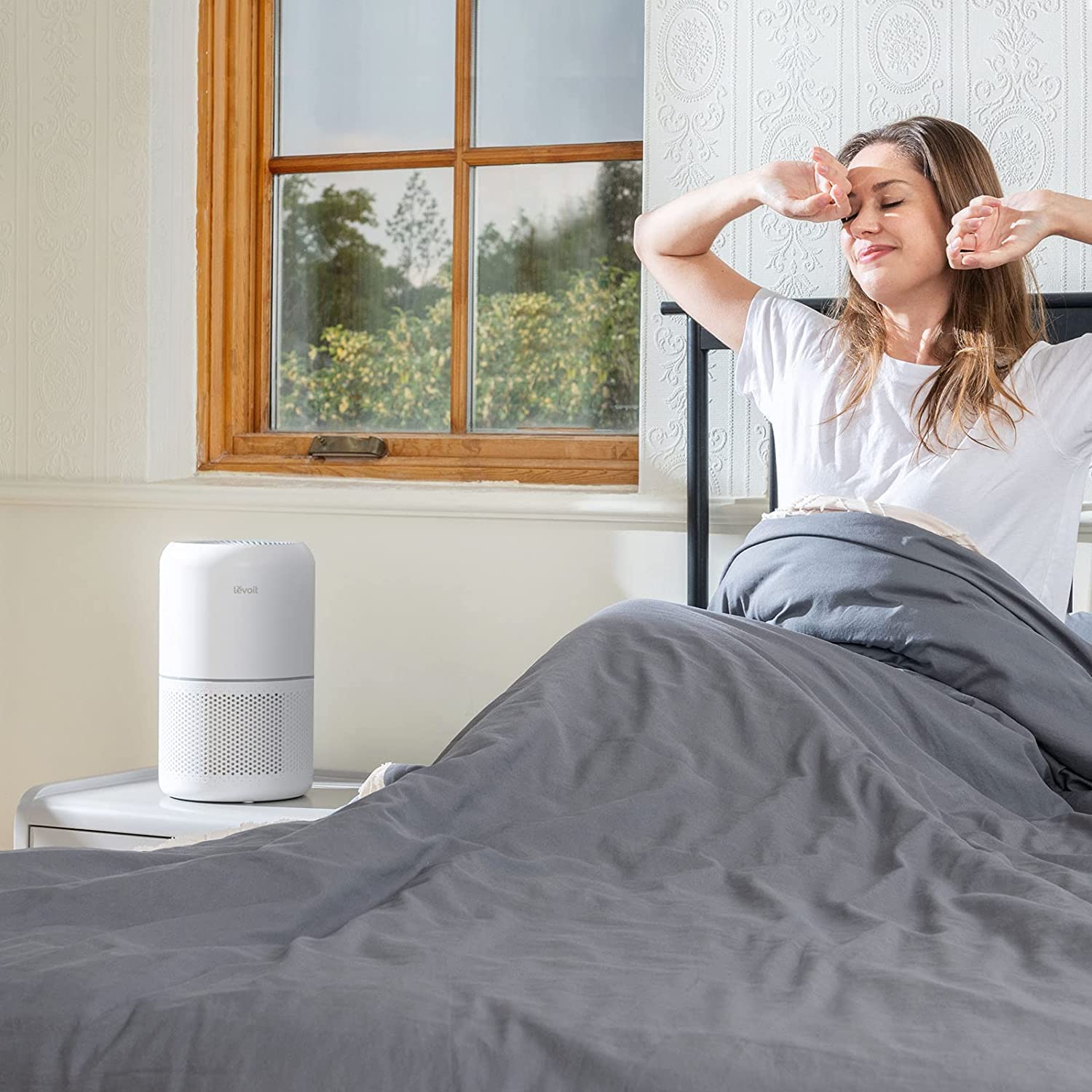 Levoit Core 300 Air Purifier in a bedroom, promoting fresh air for a healthy morning.