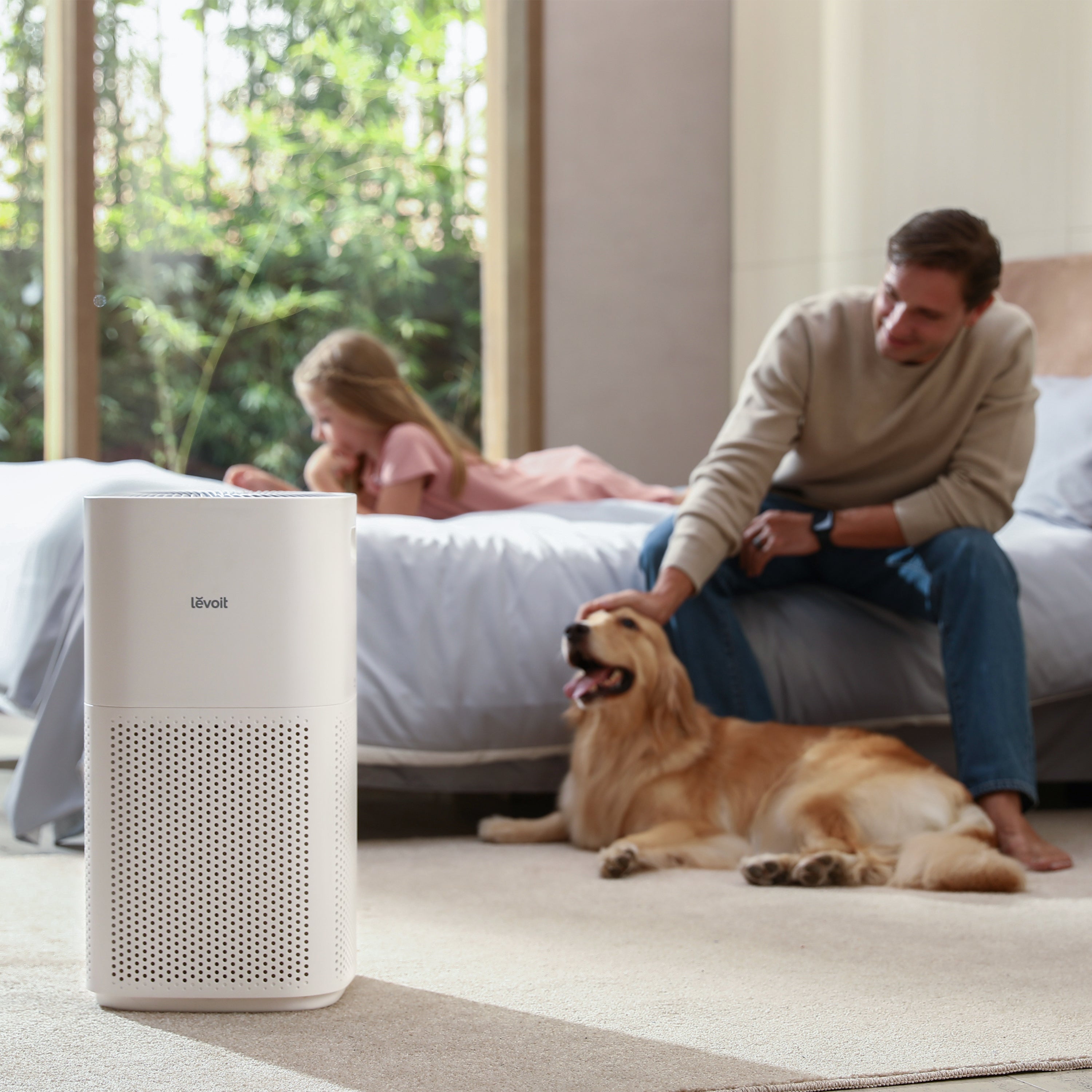 Levoit Core 600S Smart Air Purifier in bedroom, ensuring clean air for family time, reducing allergens and improving air quality for pets and children.